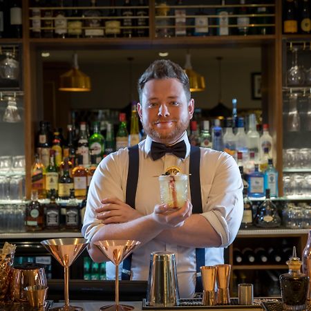 Clayton Hotel Dublin Airport Coolock Esterno foto Bartender with a drink